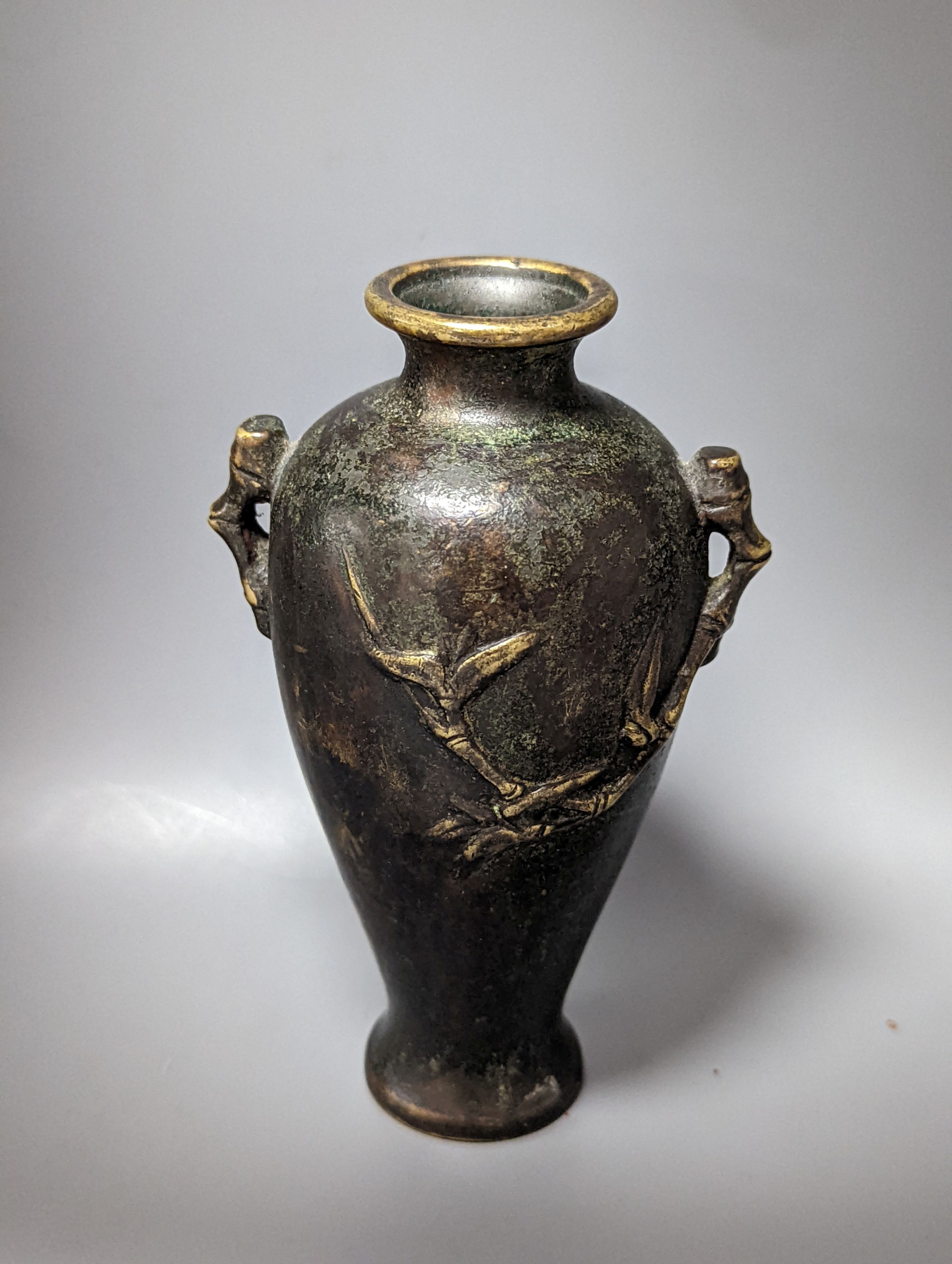 A Chinese bronze vase, 12cm., and an Islamic pierced brass lamp